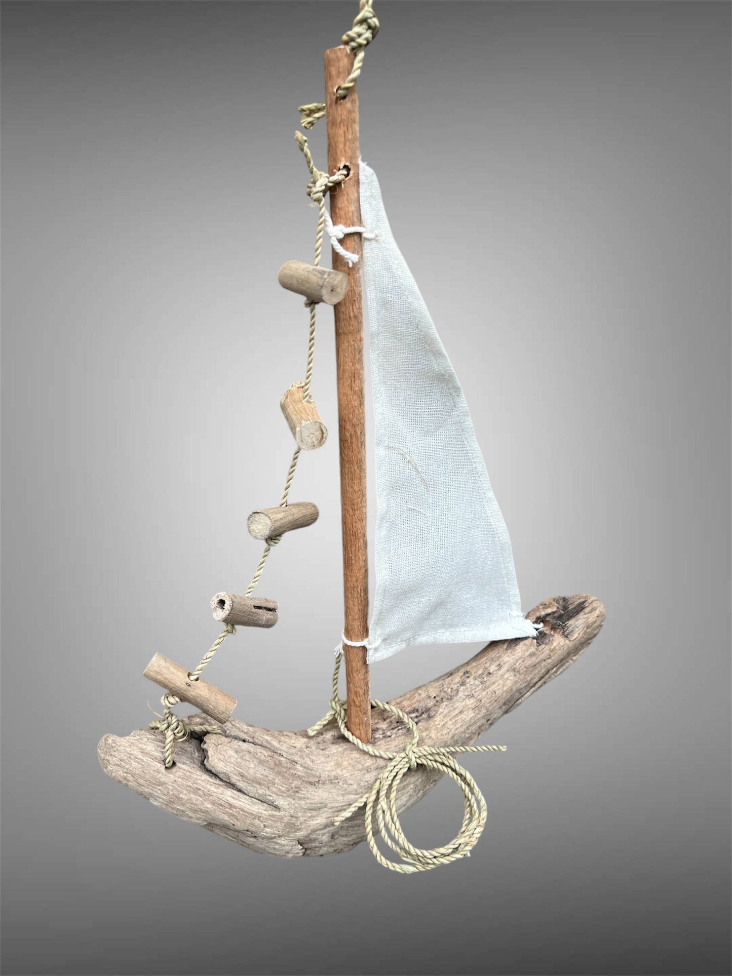 Hanging driftwood boat mobile. 